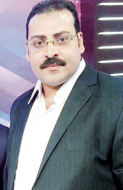 ماجد نادى رئيس النقابة العامة لبقالى التموين